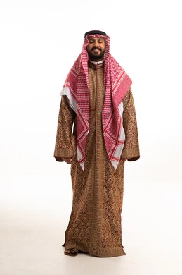 Saudi Man in Traditional Brown Bisht and Shemagh