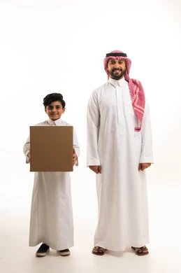 Saudi Man and Boy Holding Cardboard Delivery Box