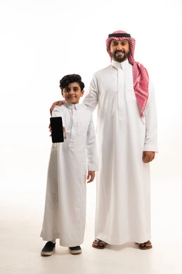 Saudi Father and Son Holding Smartphone White Background