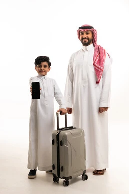 Saudi Man and Boy with Suitcase and Smartphone