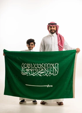 Saudi Man and Boy Holding Saudi Arabia Flag