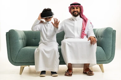 Saudi Father and Son with Virtual Reality Headset