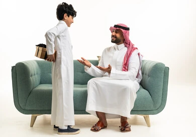 Saudi Father and Son with Surprise Gift Indoor