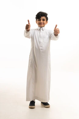 Saudi Boy in Traditional Thobe Giving Thumbs Up