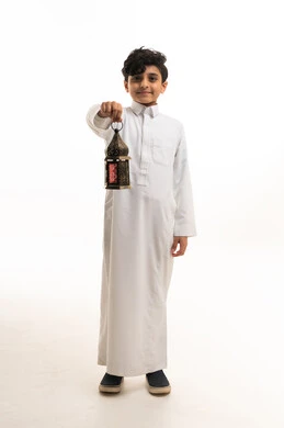 Saudi Boy in White Thobe Holding a Ramadan Lantern