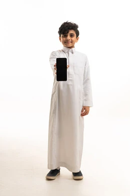 Saudi Boy in White Thobe Holding Blank Smartphone