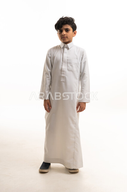 Young Saudi Boy in Traditional White Thobe Studio Shot