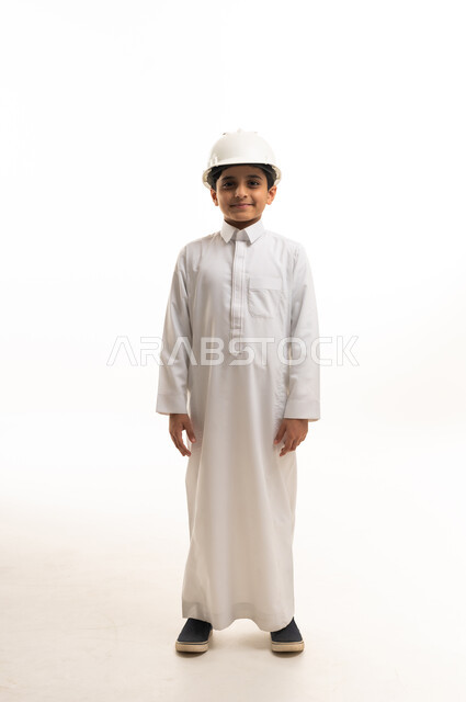 Saudi Boy in Thobe Wearing Construction Safety Helmet