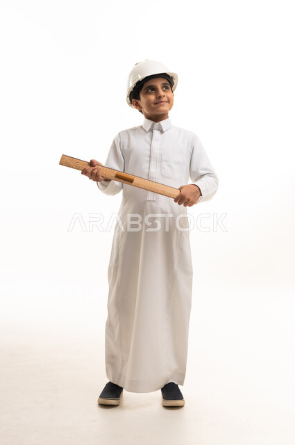 Saudi Boy Engineer with Blueprint and Safety Helmet