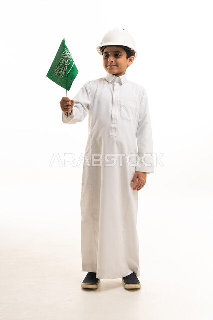 Saudi Boy in Safety Helmet Holding Saudi Arabian Flag