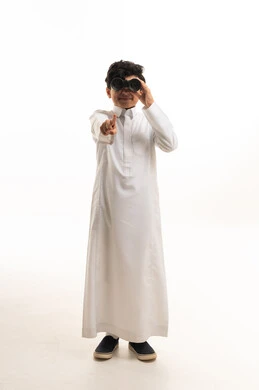 Saudi Boy in White Thobe Holding Binoculars