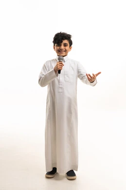 Saudi Boy in Traditional Thobe Holding Microphone Studio