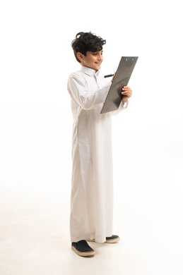 Saudi Boy in Traditional Thobe Writing on Clipboard