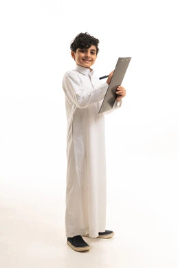 Saudi Boy in Traditional Thobe Writing on Clipboard