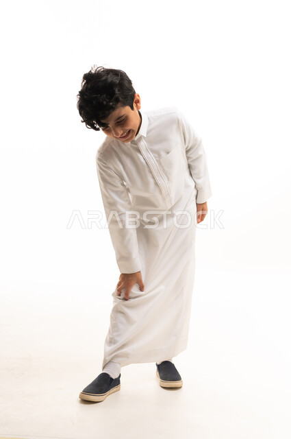 Saudi Boy in White Thobe on White Background
