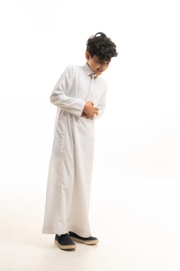 Saudi Boy in Traditional White Thobe Laughing Studio