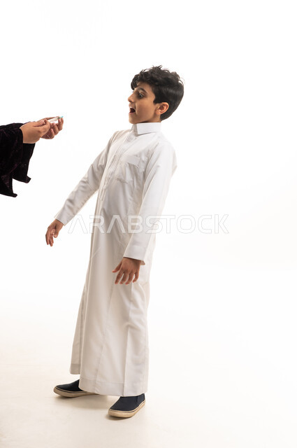 Surprised Saudi Boy in White Thobe on White Background