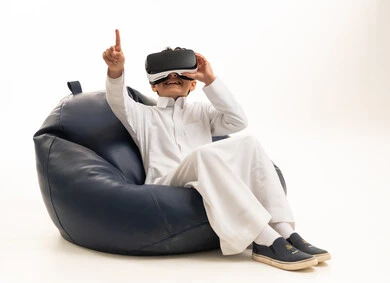 Saudi Boy Using VR Headset on White Background