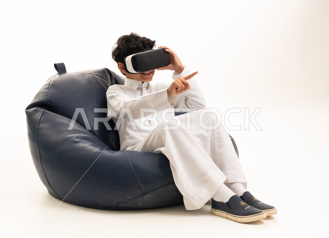 Saudi Boy Using VR Headset on White Background