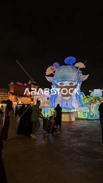 Global Village Dubai Night Light Sculpture and Visitors