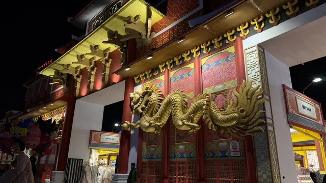 Golden Dragon Sculpture at Chinese Pavilion Entrance at Night