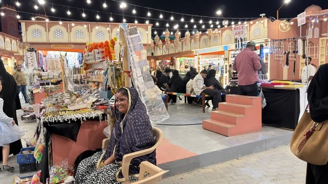 Traditional Night Market Stall with Merchant and Shoppers