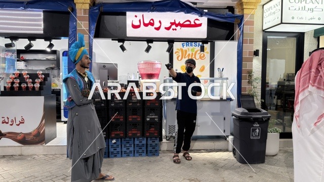 Juice Stall Vendor and Man in Traditional Costume