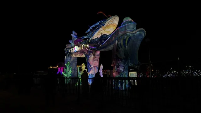 Global City Illuminated Whale Entrance Arch at Night