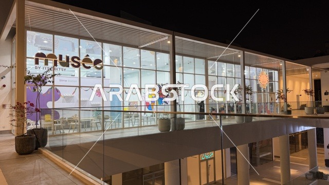 Musée Store Exterior Modern Glass Facade at Night