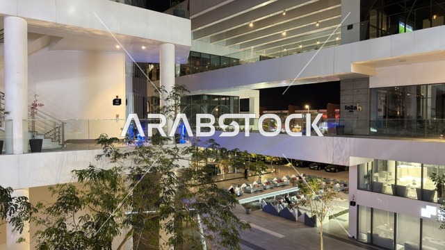 Modern Commercial Complex at Night with Lighting