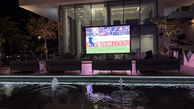 Outdoor Football Match Screen at Night