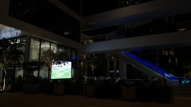 Outdoor Football Screen at Modern Building Night Outdoor Football Screen at Modern Building Night