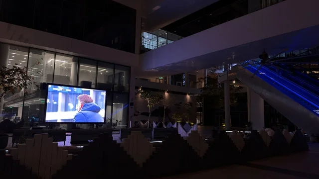 Digital Screen in Modern Commercial Building at Night