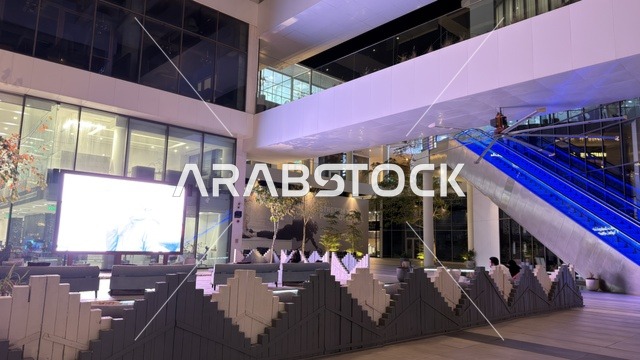Modern Shopping Mall Interior with Digital Screen at Night