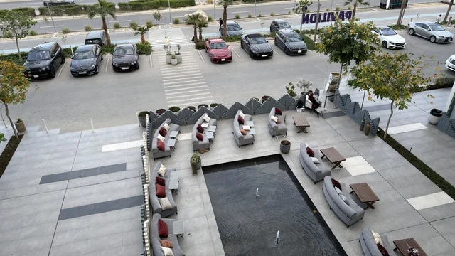 Modern Outdoor Terrace with Fountain and Seating
