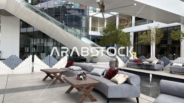 Modern Outdoor Lounge and Escalator in Commercial Plaza