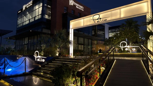 Patio Restaurant and Salon Building Entrance at Night