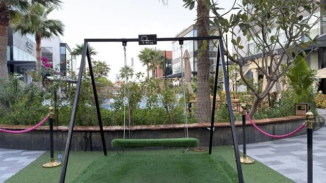 Modern Outdoor Swing in Urban Commercial Plaza