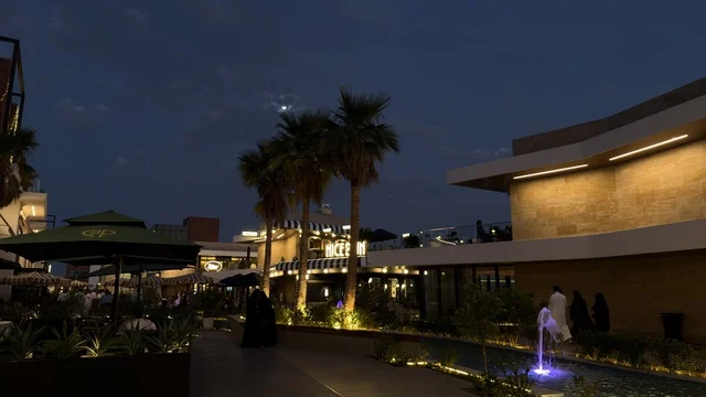 ساحة تجارية حديثة خارجية مع نافورة في الليل