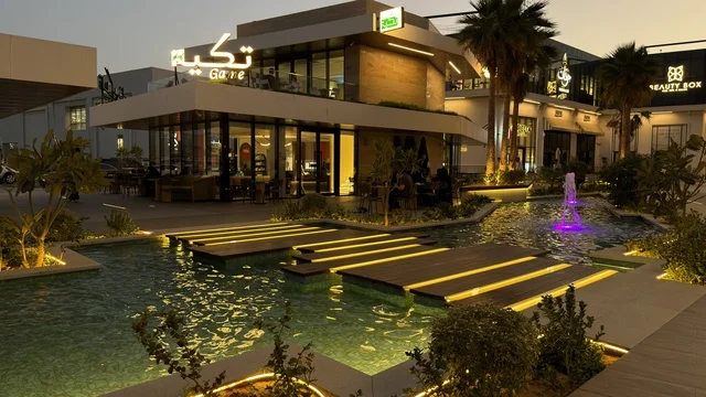 Takya Restaurant Building with Water Feature at Night