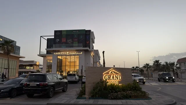Grand House Commercial Building and Retail Complex at Dusk