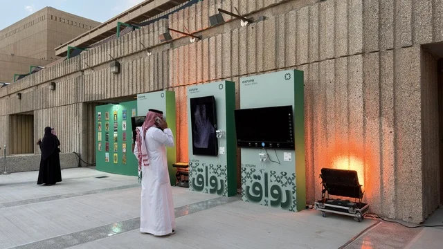 Rawaq Outdoor Exhibition with Saudi Man and Digital Screens