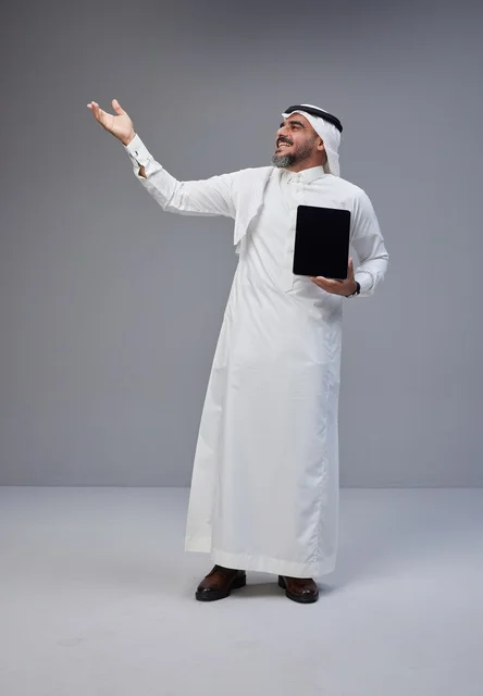 Saudi Man Holding Blank Tablet Screen in Studio