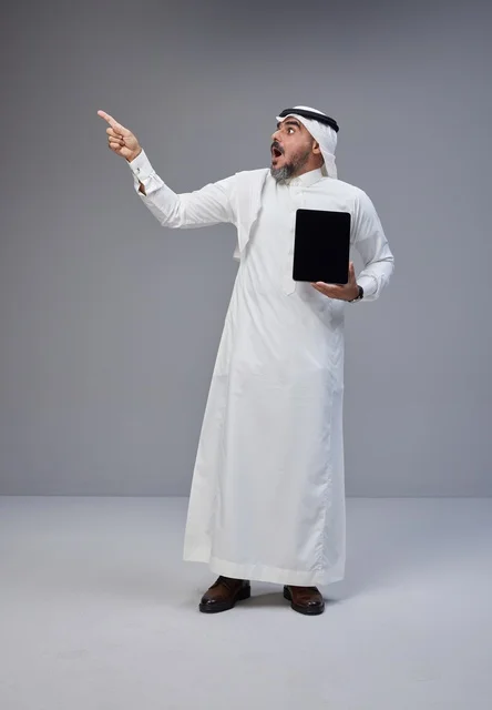 Saudi Man in Traditional Thobe Holding Blank Tablet
