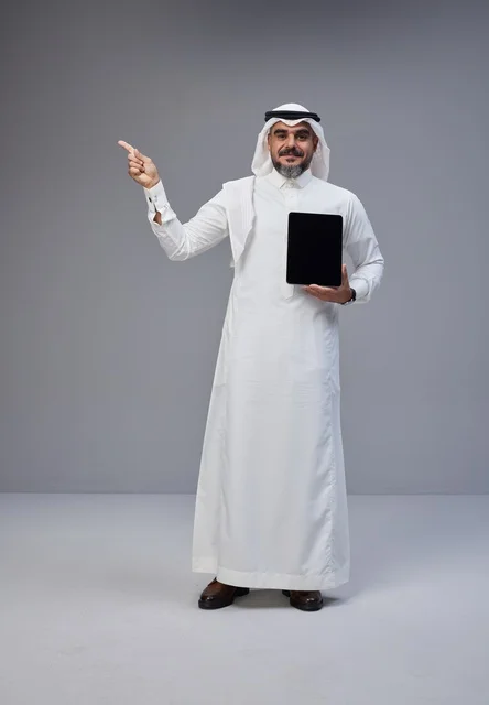 Saudi Man in Traditional Dress with Tablet Blank Screen