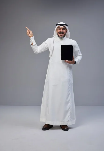 Saudi Man in Traditional Dress Holding Tablet Mockup