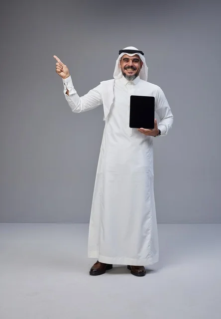 Saudi Man Holding Blank Tablet and Pointing Up