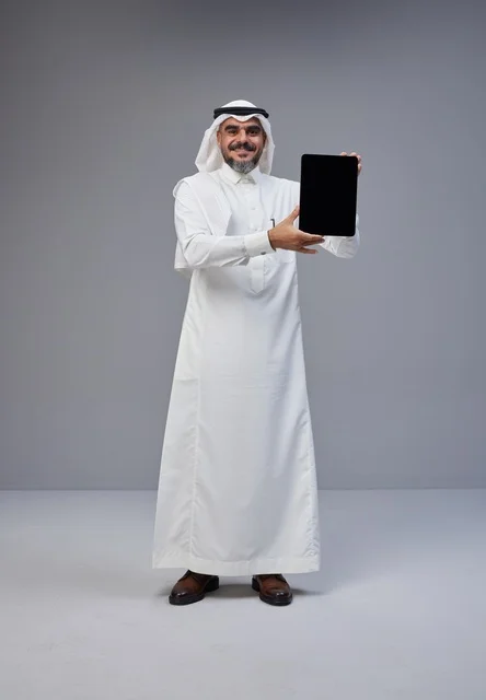 Saudi Man in Traditional Dress with Tablet Mockup