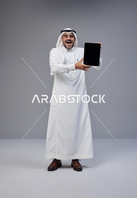 Saudi Man Holding Digital Tablet with Blank Screen