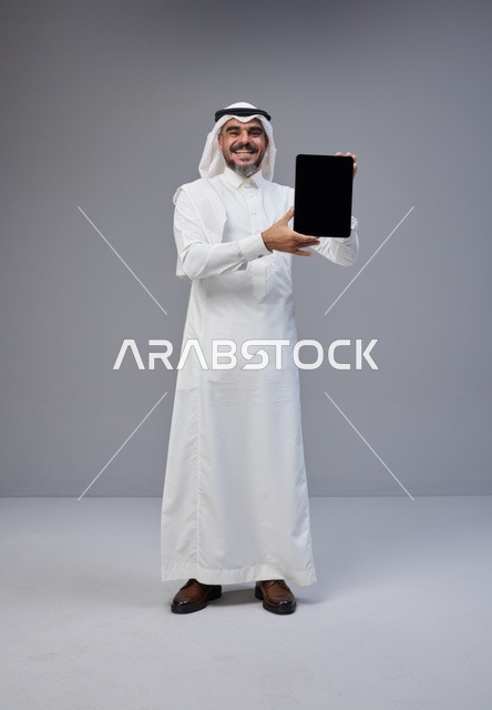 Saudi Man Holding Digital Tablet with Blank Screen
